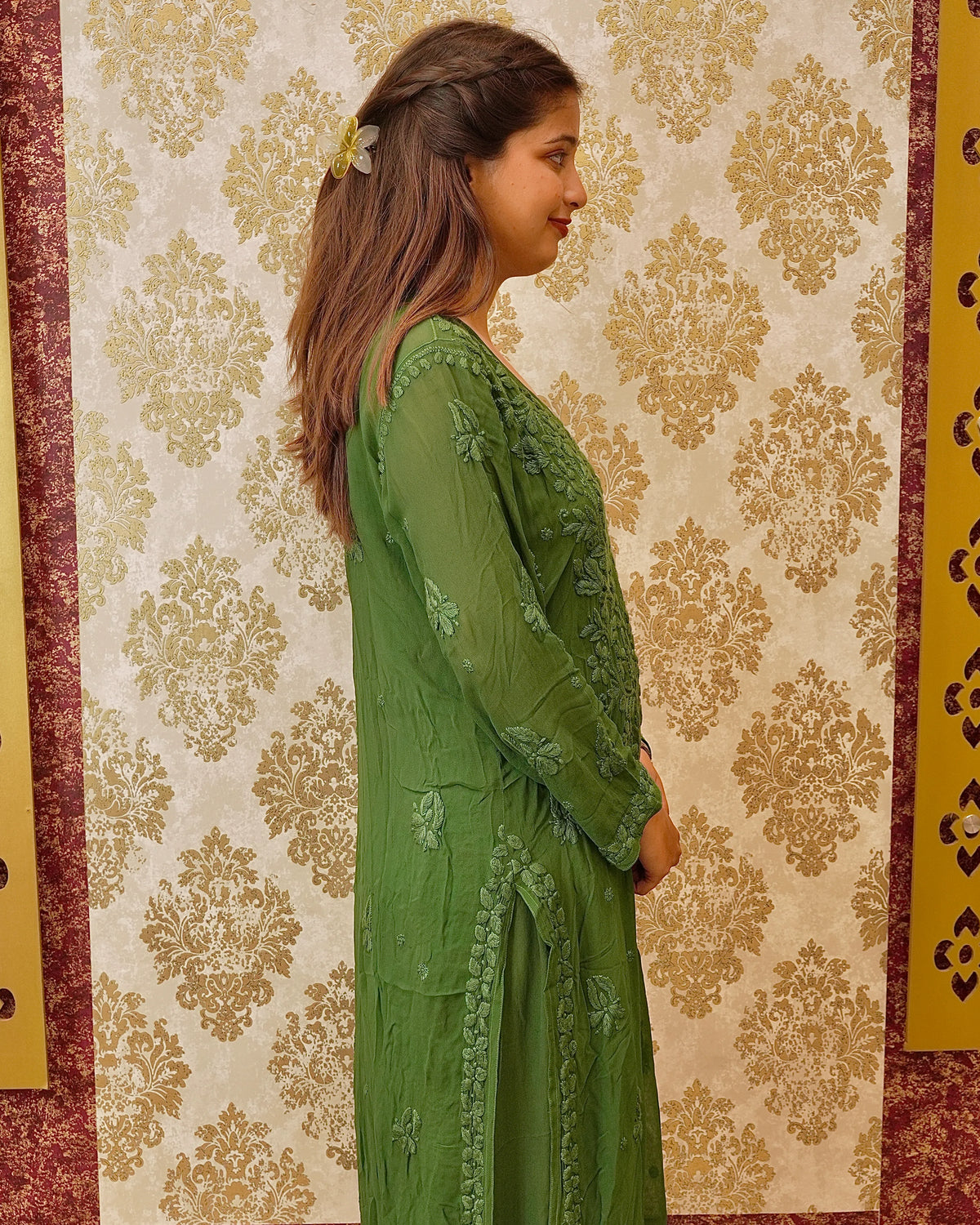 Close-up of intricate 3D Chikankari hand embroidery on a green Viscose Georgette Kurti sleeve.