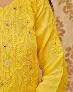 View a stunning white Viscose Mirror Work Set, a luxurious georgette kurti design for ethnic wear.