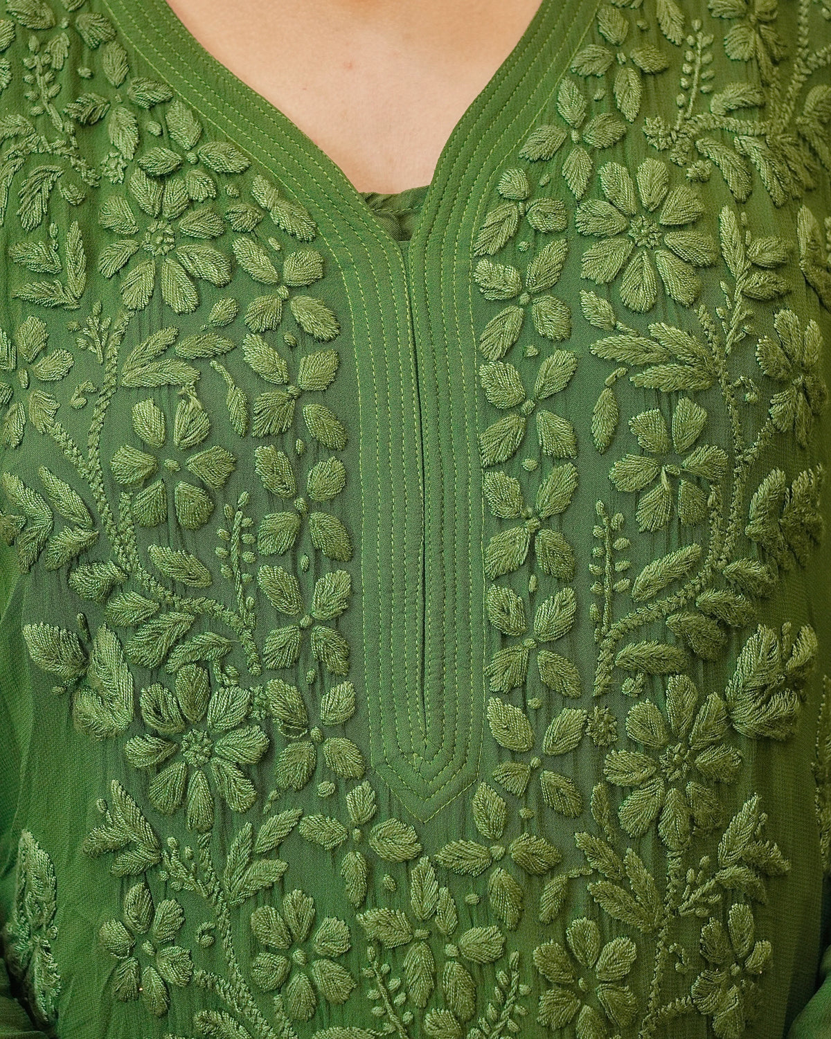 View a dark green Viscose 3D Chikankari Kurta Set in premium georgette fabric.