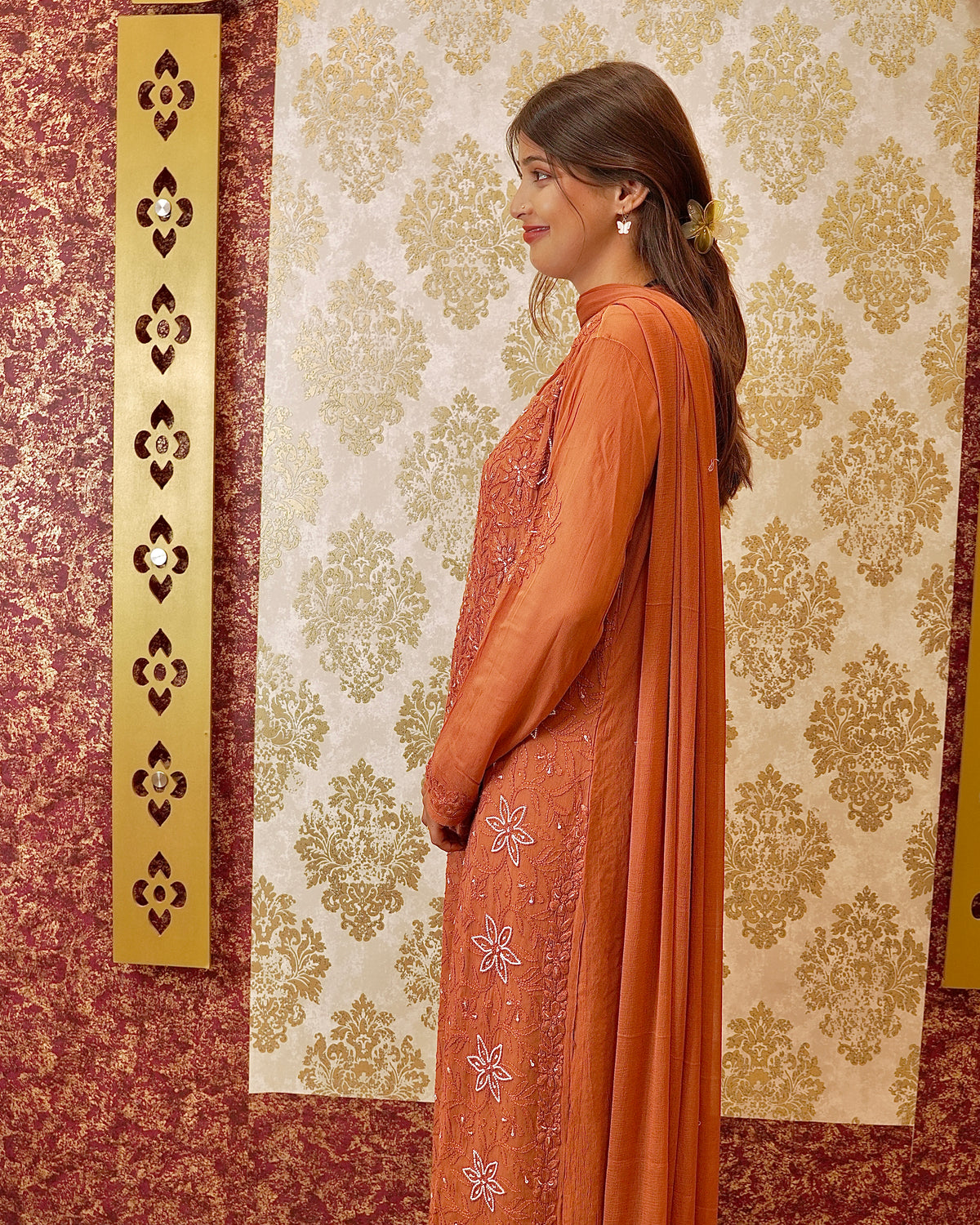 View an orange Viscose Designer Kurta Set with Zardozi and Chikankari work on georgette fabric.