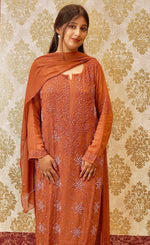 Close-up of the Zardozi and Chikankari design on an orange Viscose Georgette Kurta. Designer kurti.
