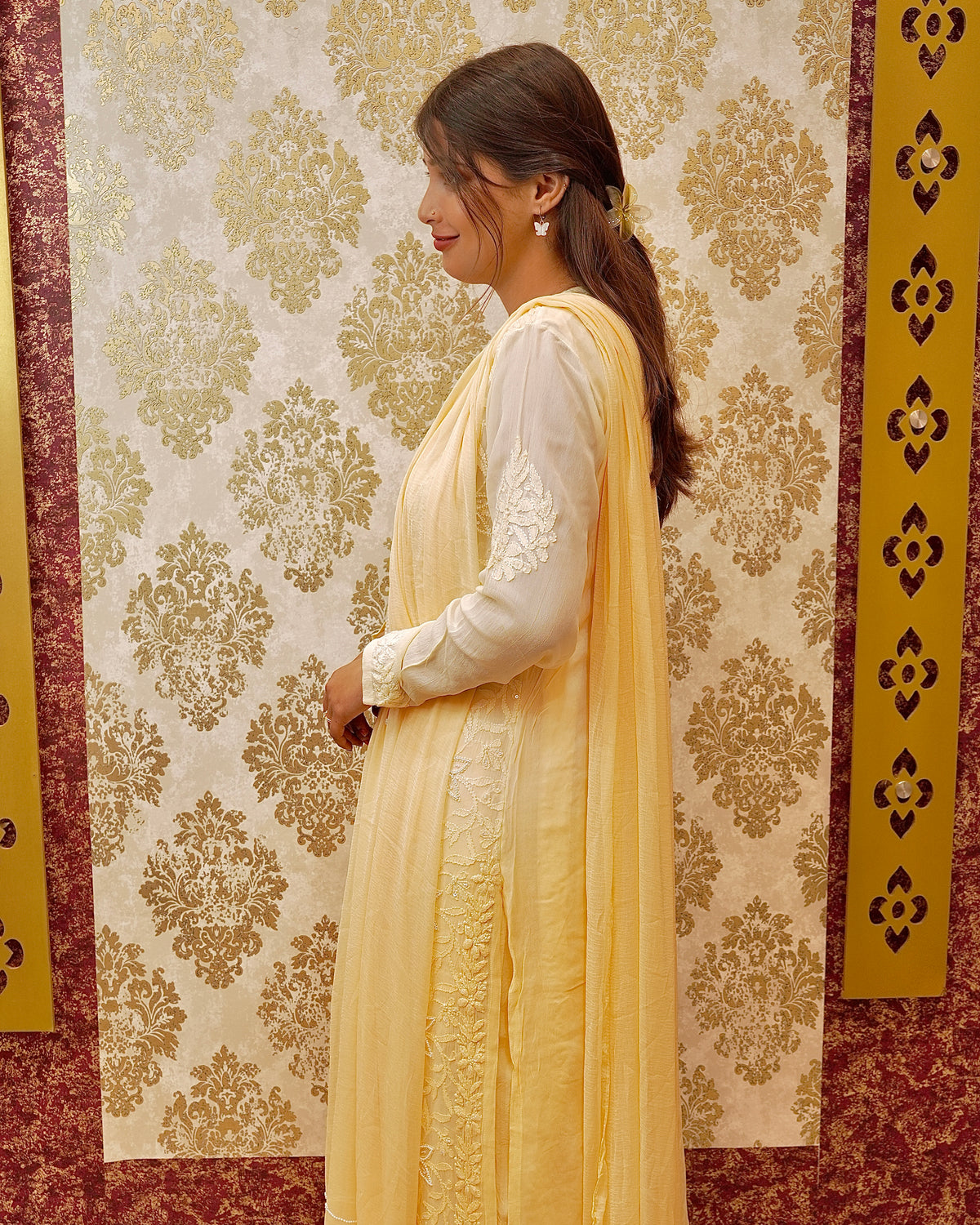 Close-up of the pure viscose fabric of a beige and yellow premium kurti, detailed with sparkling cut dana.