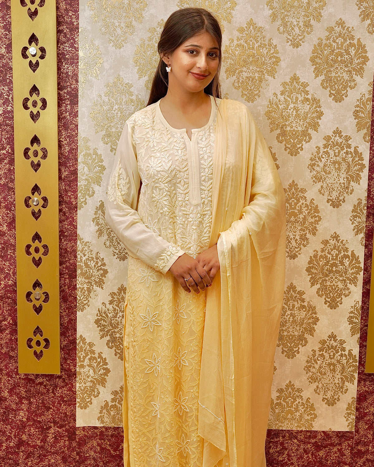View a beige & yellow Premium Kurti Set in viscose georgette with Chikankari and sequin embroidery.