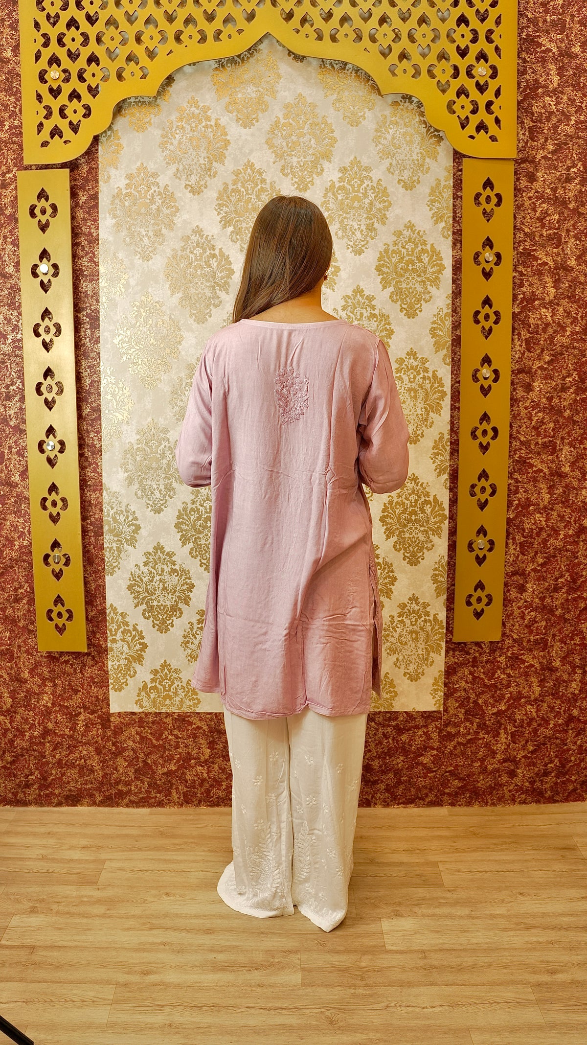 Back view of a white Kali Palazzo, highlighting its unique cut and Lucknowi hand embroidery. Stylish ethnic bottom wear.