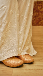 View an elegant white Kali Palazzo with its unique cut and Lucknowi hand embroidery. Comfortable bottom pants.