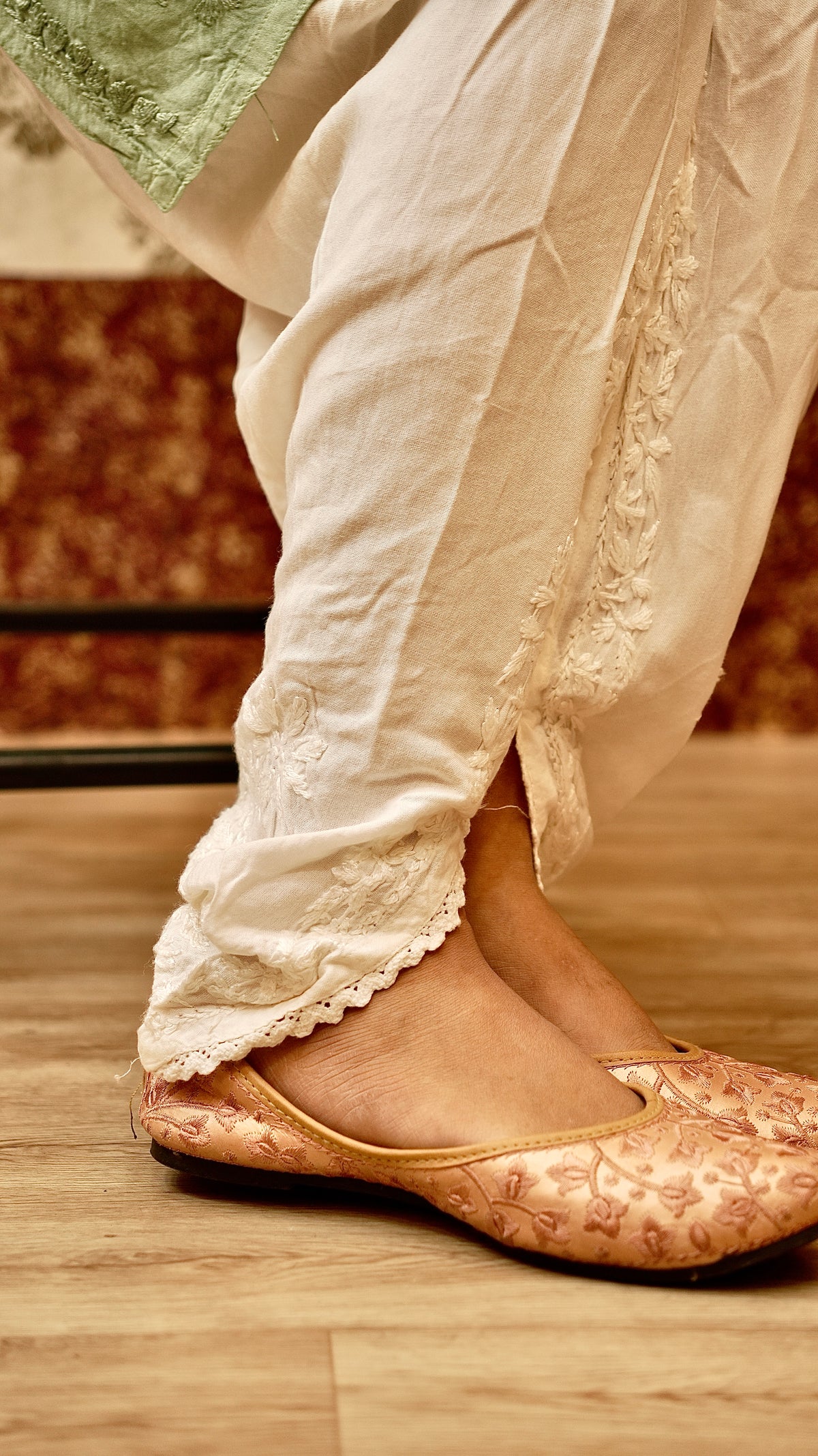 Close-up of a flowing Tulip Pant in Cotton Rayon fabric with detailed hand embroidery. Ideal bottom wear.