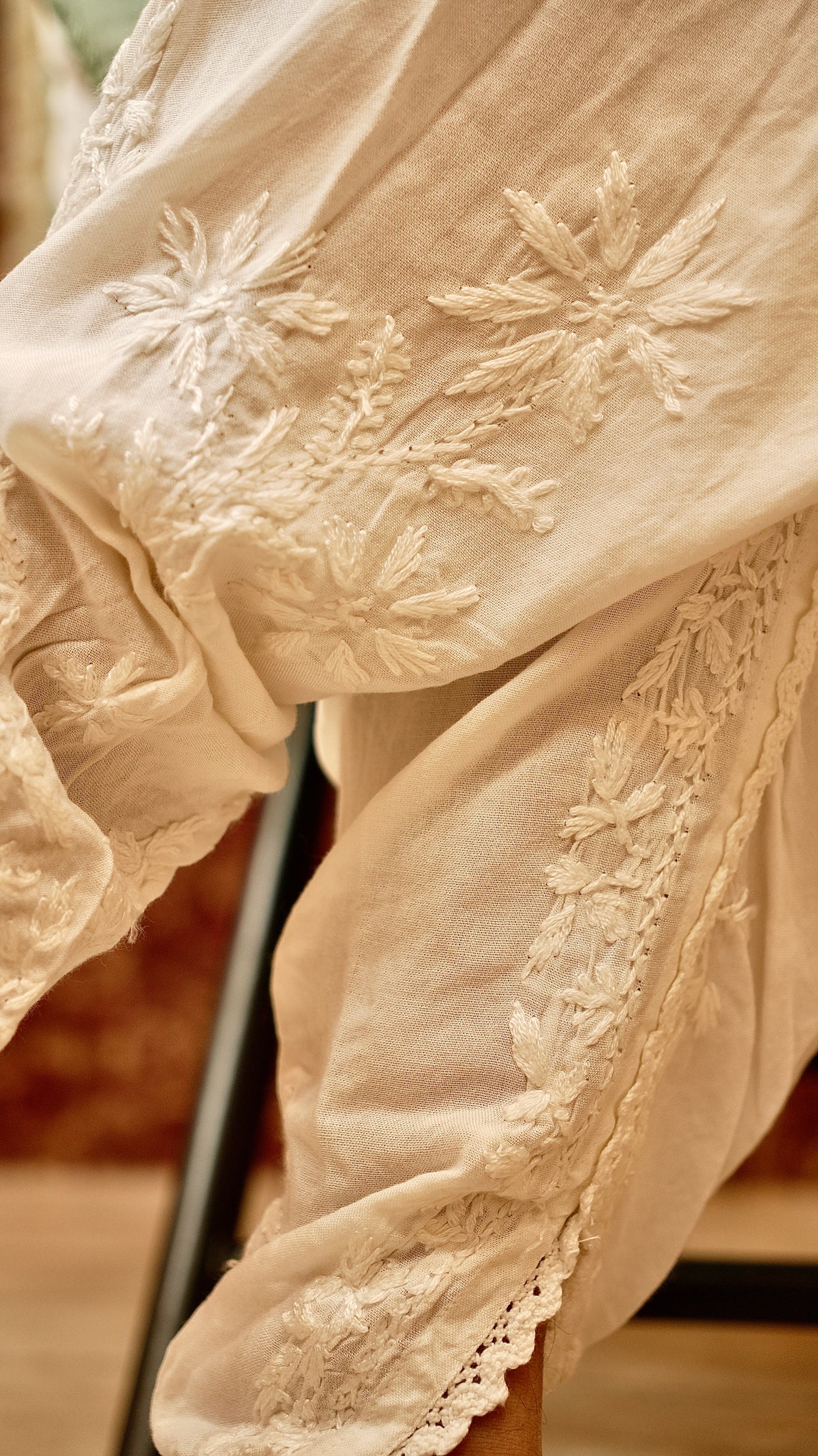 View intricate hand embroidery on a Cotton Rayon Tulip Pant. Showcases fine craftsmanship for women's bottom wear.