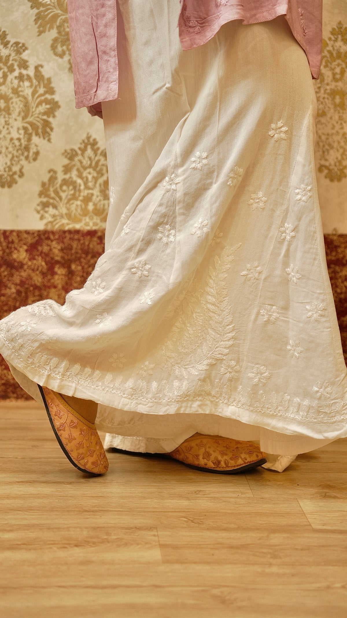 Close-up of fine Lucknowi handwork on a white Kali Palazzo. Features breathable Cotton Rayon bottom wear.