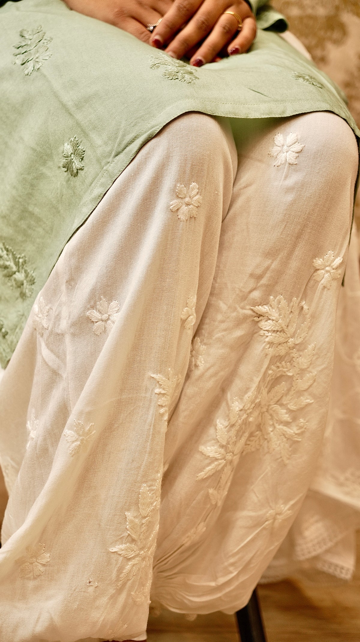 Close-up of the delicate Lucknowi Chikankari embroidery on a white Afghani pant. Comfortable bottom pants.