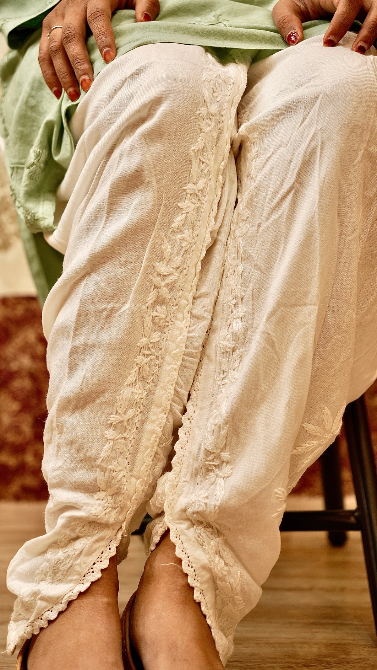 View a women's Tulip Pant, showcasing its signature cut and hand-embroidered details. Perfect ethnic bottom wear.