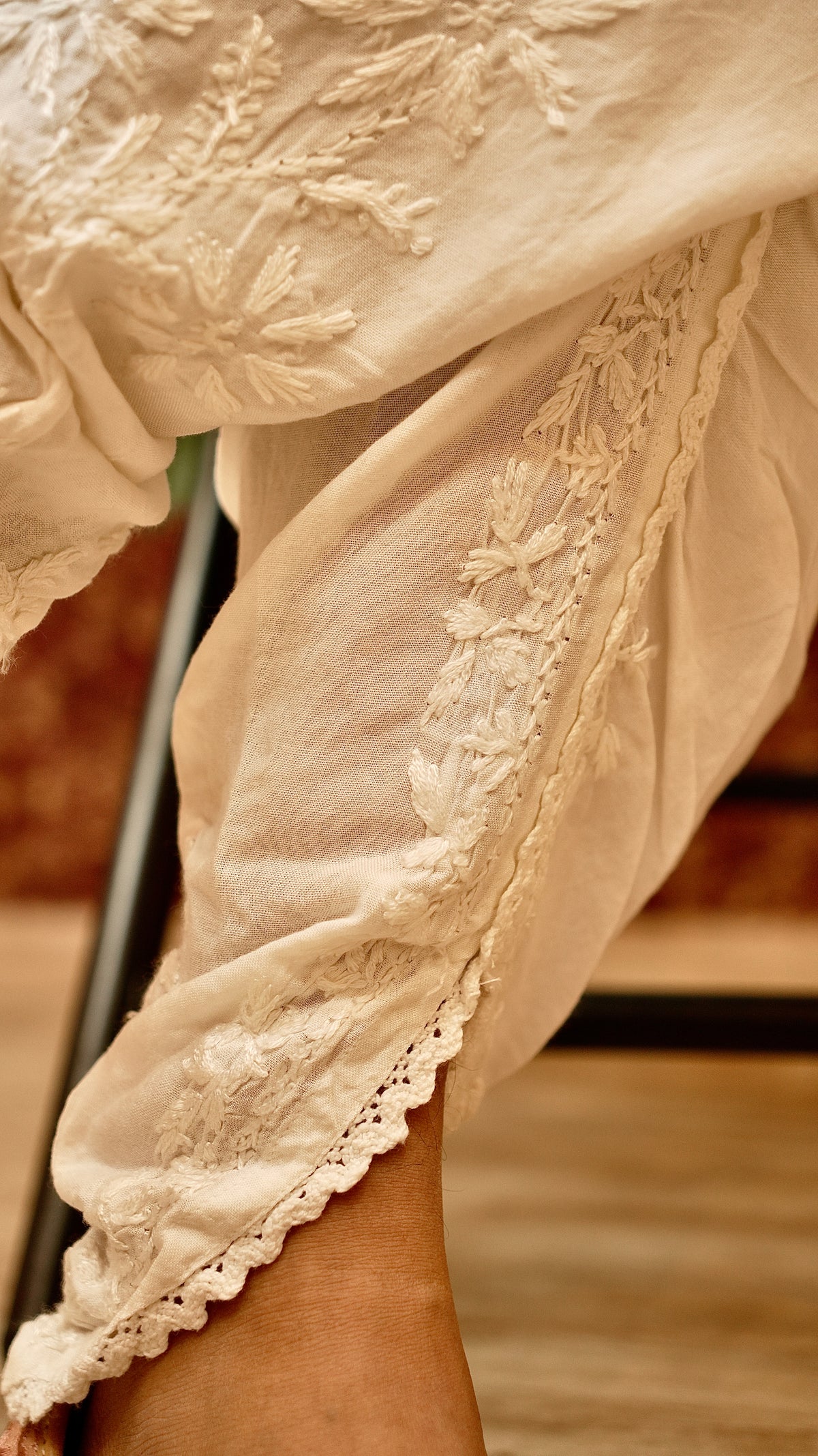 Close-up of the delicate hand embroidery on a Cotton Rayon Tulip Pant. A breathable and elegant bottom wear.
