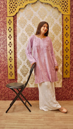 View the elegant drape of a white Kali Palazzo, showcasing original Lucknowi handwork. Stylish ethnic bottom wear.