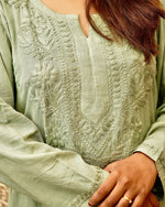 Pista green kurta with detailed white Chikankari embroidery.