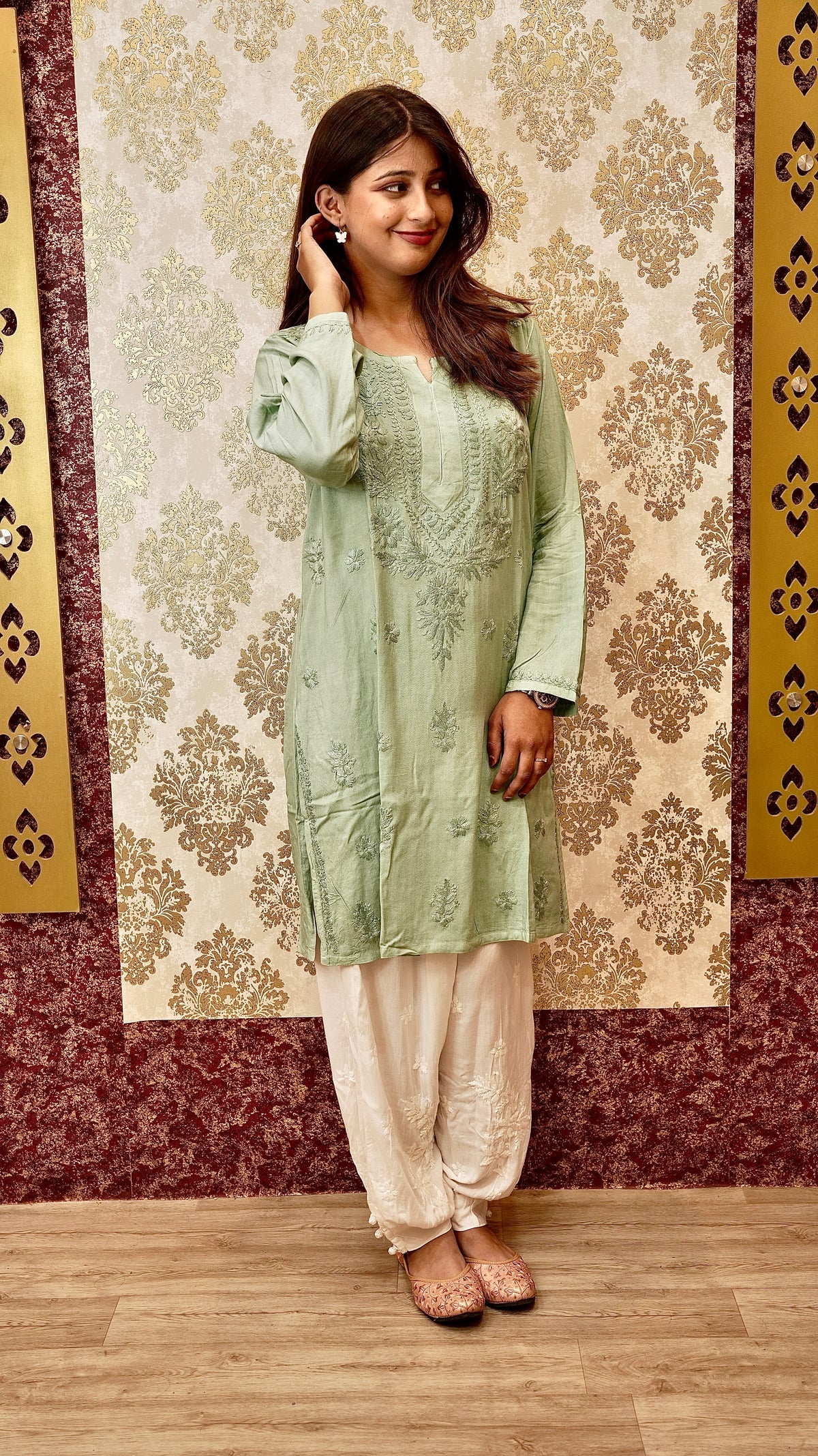 Close-up of intricate Lucknowi Chikankari handwork on a white Afghani pant. Exquisite bottom pants.