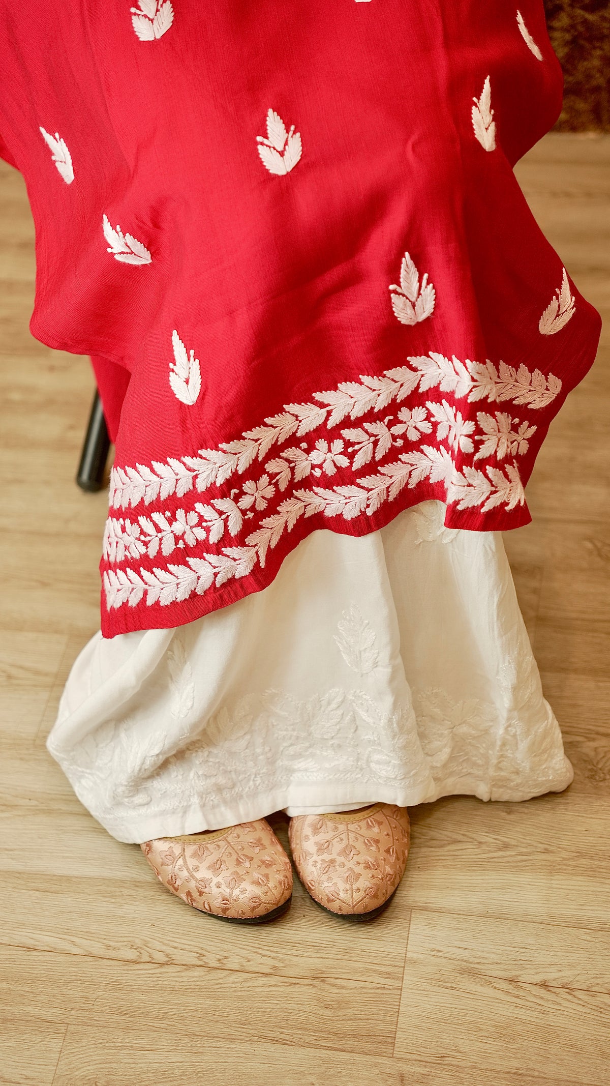 View a gracefully draped palazzo in soft rayon cotton. Features authentic Lucknowi handwork, a comfortable bottom wear.