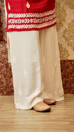 Close-up of the detailed Lucknowi hand embroidery at the hem of a rayon cotton palazzo. Exquisite ethnic bottom wear.