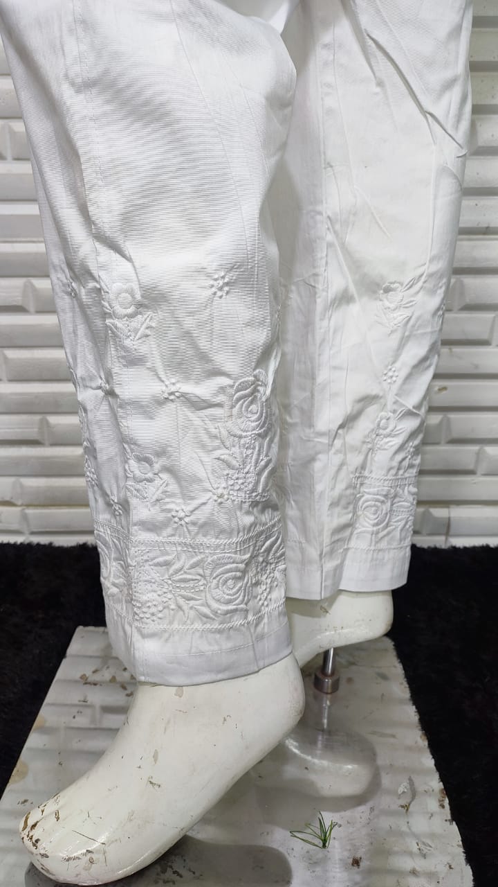 View crisp white Rose Cotton Lycra Pants. Features delicate machine embroidery for comfortable bottom wear.