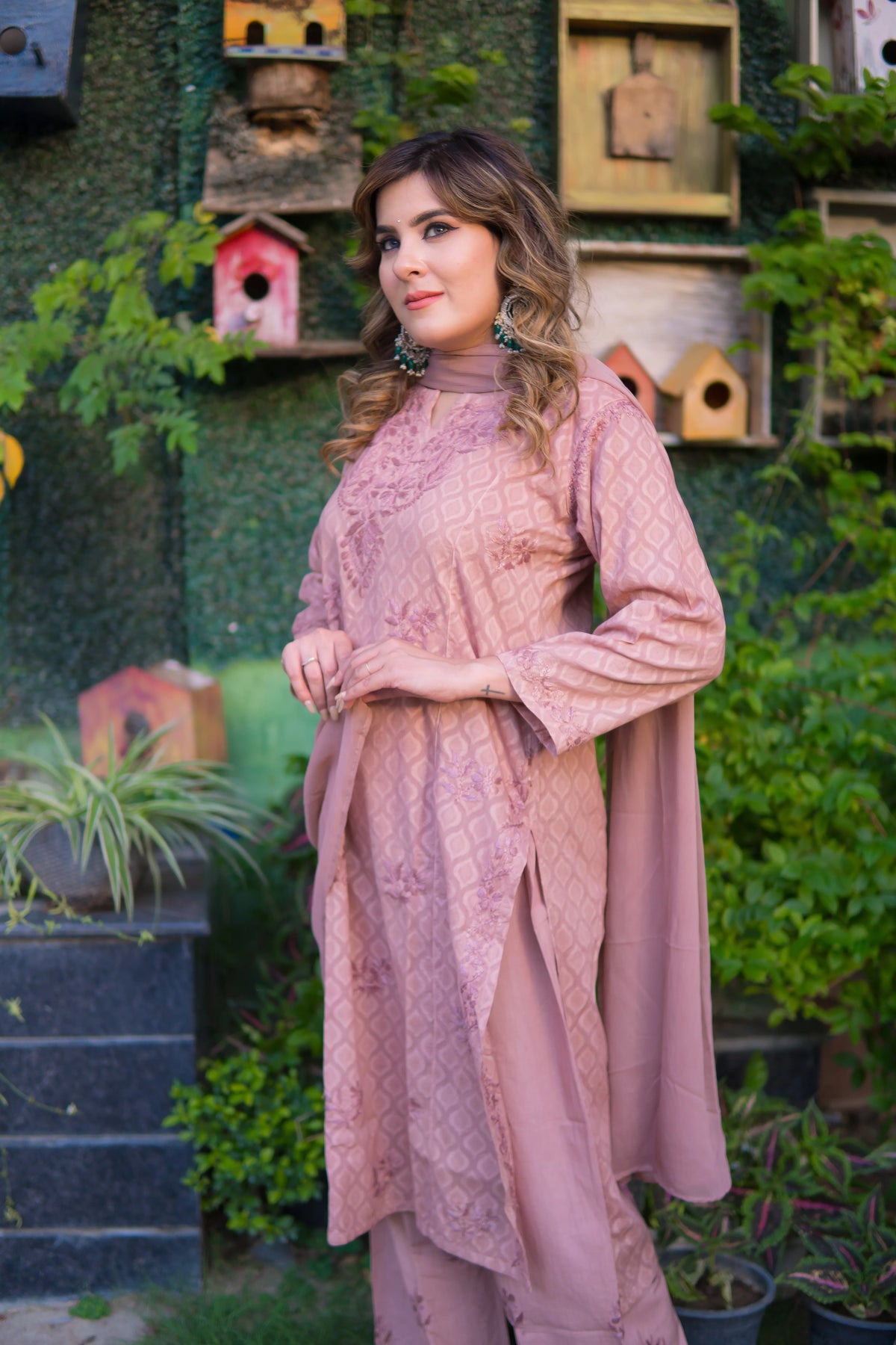 A side view shows a woman in a mauve pink mul cotton kurta outfit with a flowing dupatta.