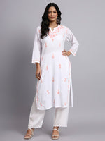 Full view of Woman wearing a white chikankari kurti with floral patterns on a gray background