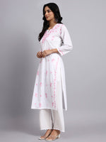 Side view of Woman wearing a white cotton kurta with pink floral embroidery on a gray background