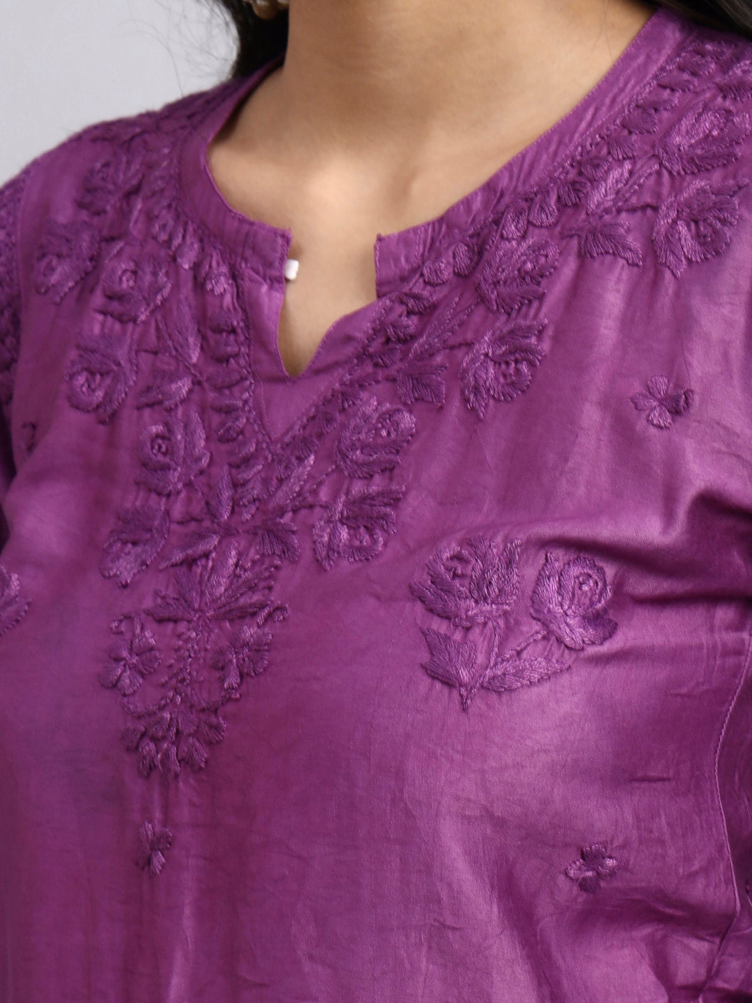 Close-up of a purple embroidered garment