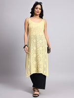 Full view of Woman wearing a yellow kurta with black pants on a gray background
