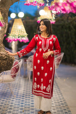 Red embroidered chikankari kurti with white palazzos festive ethnic wear for women.