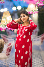 Full shot of a woman in a beautiful red traditional kurta set with white embroidery.