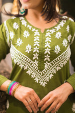 Front view of green chikankari kurta made with soft fabric and detailed embroidery, ideal for elegant ethnic wear.