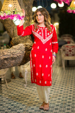 Front view of a vibrant red Lucknowi Chikankari Kurta. This pure cotton Kurti for women features intricate white embroidery.