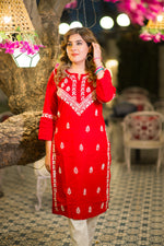 Front view of a beautiful red pure cotton kurta featuring traditional white Lucknowi Chikankari.