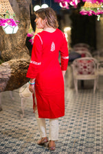 Back view of a comfortable pure red cotton kurta for women featuring subtle white Lucknowi Chikankari. 