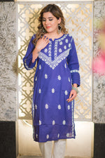 Full shot of a model in a royal blue riwayat kurta featuring white chikankari work.