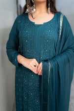 View a Blue Viscose Set, a georgette kurta set featuring exquisite Chikankari and Mukaish work.