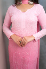 Close-up of intricate Chikankari and dazzling Mukaish on a Pink viscose georgette fabric.