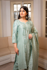 Close-up of Chikankari handwork and Zari Cut Dana on a Green chanderi fabric kurti set.