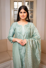 Intricate Chikankari with glistening Zari Cut Dana work on a luxurious Green chanderi kurti.