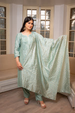 Luxurious Green chanderi kurta set, showcasing beautiful drape and detailed Chikankari work.