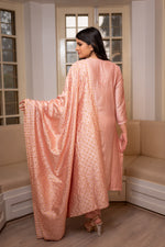 Close-up of intricate Chikankari motifs on a Pink chanderi kurti, embellished with Zari work.