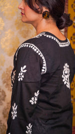 Side back of intricate Chikankari hand embroidery on a black soft cotton kurti, a classic ethnic design.