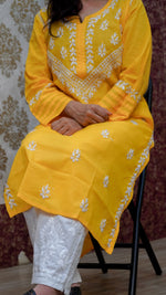 Vibrant yellow Chikankari kurti, featuring intricate white thread embroidery, designed for comfortable everyday wear.