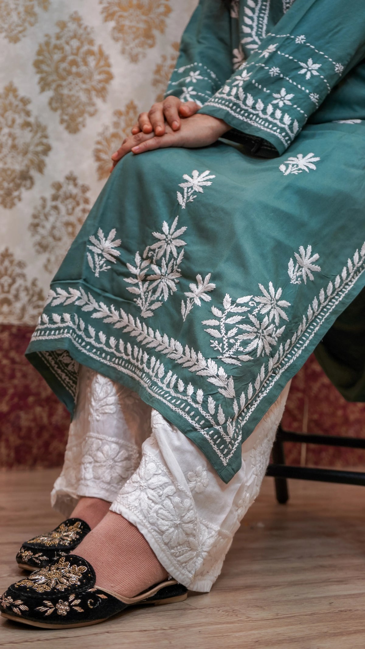 Close-up of Chikankari Ghasspatti handwork on a pista green Modal Kurti, traditional Lucknowi artistry.
