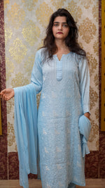 Full shot of a sky blue Modal Satin Pearl kurti, with Chikankari pearl & sequence work.
