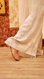 Side view of a flowing viscose georgette palazzo, showcasing Chikankari embroidery. Stylish bottom wear.