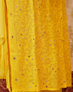 Close-up of the pure viscose georgette fabric and mirror work on a white Viscose Kurta Set.