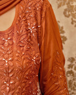Close-up of rich Zardozi and Chikankari embroidery on an orange Viscose Georgette Kurti.