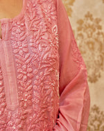 Detailed Lucknowi Chikankari and pearl cut dana embroidery on a Piyazi Pink viscose georgette material.
