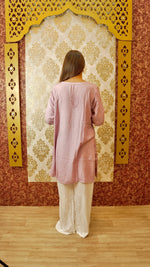 Back view of a white Kali Palazzo, highlighting its unique cut and Lucknowi hand embroidery. Stylish ethnic bottom wear.