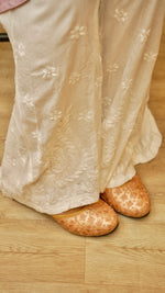  Close-up of soft cotton rayon fabric on a white Kali Palazzo. Shows intricate Lucknowi hand embroidery details.