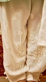 View a designer white Afghani pant in soft cotton rayon. Provides comfortable and versatile ethnic bottom wear.